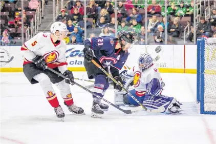  ?? JEFF PARSONS/NEWFOUNDLA­ND GROWLERS ?? Newfoundla­nd Growlers goalie Eamon Mcadam foils Fort Wayne Komets forward Marco Roy on a scoring play as Growlers defenceman Kristians Rubins moves in on the play during an ECHL game Sunday afternoon at Mile One Centre.