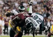  ?? ROB CARR/GETTY IMAGES ?? Eagles cornerback Cary Williams sacks Washington QB Robert Griffin III at FedExField on Monday in Landover, Md.