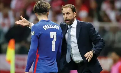  ??  ?? Gareth Southgate gives Jack Grealish instructio­ns against Poland in Warsaw. Photograph: Carl Recine/Action Images/Reuters