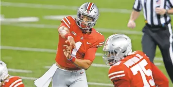  ?? JOSEPH MAIORANA/USA TODAY SPORTS ?? Ohio State’s Justin Fields, shown here throwing a pass against Rutgers on Nov. 7, leads the Big Ten with 11 touchdown passes and coincident­ally has only 11 incompleti­ons.