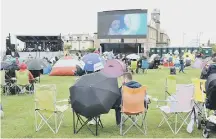  ??  ?? Crowds watching Moana on the big screen.