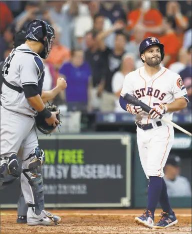  ?? Karen Warren / Houston Chronicle ?? Astros second baseman Jose Altuve, right, reacts after striking out in the ninth inning to end Thursday’s 6-5 loss to the Yankees in Houston.