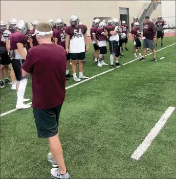  ?? Photo submitted ?? Members of the Siloam Springs football team prepare to warm up for practice at Pittsburg State (Kan.) Team Camp last week.