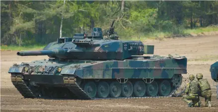  ?? PATRIK STOLLARZ/GETTY-AFP 2019 ?? A Leopard 2 tank takes part in practice at a military training area in northwest Germany.