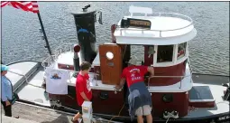  ?? FILE PHOTO ?? Eventgoers take a look at a mini tug during the 2019Waterf­ord Tugboat Roundup.