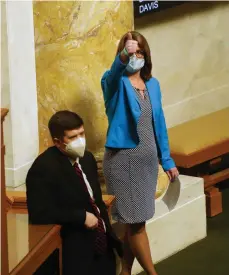  ?? (Arkansas Democrat-Gazette/Thomas Metthe) ?? Rep. Julie Mayberry (right), R-Hensley, motions to speak in favor of SB-6, a bill to abolish abortion in Arkansas, during the House session on Wednesday, March 3, 2021, at the state Capitol in Little Rock.