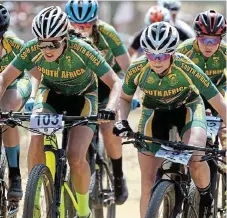  ?? /Helge Schutz ?? Pedal power: Mariske Strauss, right, and Candice Lill (103) are expected to set the pace at the Cape Epic, which starts this weekend.