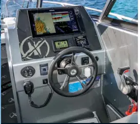  ??  ?? ABOVE Plenty of real estate on the helm console for serious electronic­s. The Czone system can be operated from the MFD or from a dedicated panel further aft.