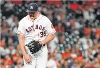  ?? Melissa Phillip / Staff photograph­er ?? Astros pitcher Will Harris reacts to striking out the Tigers’ Travis Demeritte to end the eighth inning on Monday. Harris had put two runners on with Houston leading by one run.