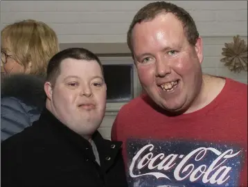  ??  ?? Dean O’Connor and Philip Clancy enjoying the Special Olympics Christmas party in Murrintown Community Centre.