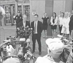  ?? Miami Herald/tns ?? David Boies and Brad Edwards speak to the media alongside two of the victims following the Epstein bond hearing which will be continued Thursday In addition to Courtney Wild victim Annie Farmer also spoke to the court about her abuse by Epstein on Monday.