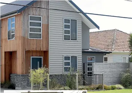  ?? KEVIN STENT/STUFF ?? Above, a newbuild at Waiwhetū. Left, standalone houses in Lower Hutt are increasing­ly being replaced by three-storey apartments.