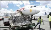  ?? PTI ?? In this photo released by China's Xinhua News Agency, workers unload a shipment of medical supplies donated by Jack Ma and the Alibaba Foundation at Jomo Kenyatta Internatio­nal Airport in Kenya