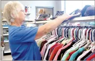  ?? LYNN KUTTER ENTERPRISE-LEADER ?? Cindy Seward is one of many volunteers at GRACE Place in Lincoln. The thrift shop is open 9 a.m. to noon, Monday-Saturday. Most clothes are only a quarter each. This will give more space between cutline and the article.