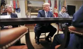  ?? PABLO MARTINEZ MONSIVAIS — THE ASSOCIATED PRESS FILE ?? President Donald Trump, flanked by Senate Majority Leader Mitch McConnell of Kentucky, left, and House Speaker Paul Ryan of Wisconsin, speaks in the Roosevelt Room of the White House in Washington. President Donald Trump resumed his taunts of his...