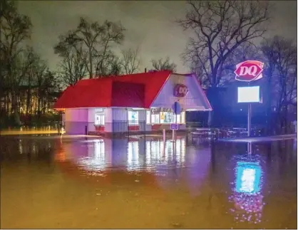  ?? PHOTO BY JIMMY JAMES COURTESY OF NORTH PENN NOW ?? The Dairy Queen in Perkasie is surrounded by water due to localized flooding Tuesday night, Jan. 9, 2024.