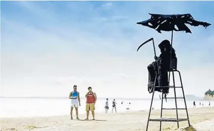  ?? COURTESY ?? Daniel Uhlfelder, a Florida Panhandle lawyer concerned about Florida’s beaches opening prematurel­y, showed up at beaches dressed as the Grim Reaper to warn people of the consequenc­es of ignoring social distancing practices.