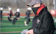  ??  ?? Homewood-Flossmoor coach Craig Buzea watches the action.