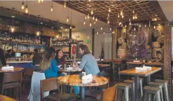  ?? Photos by Amy Brothers, The Denver Post ?? Patrons at Mizu enjoy drinks.