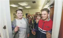  ??  ?? Cutting the ribbon are, from left, Kieran Boyce, Luaren Negaard and Dylan Breeze.