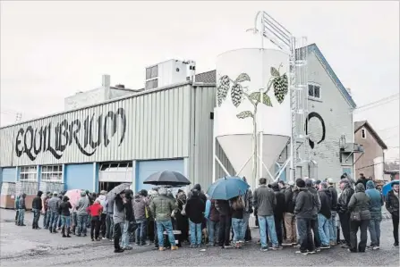  ?? EVA DEITCH NYT ?? Customers lined up for a can and bottle release at Equilibriu­m in Middletown, N.Y. Massachuse­tts, New Jersey, Pennsylvan­ia and Rhode Island.