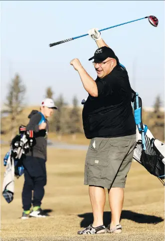  ?? DARREN MAKOWICHUK ?? Justin Bugera and his son Jason played 18 holes on Sunday at Fox Hollow golf course, where they plan to stay open until the snow blows. Calgary was among the warmest cities on the continent over the weekend and the really good news is that double-digit...