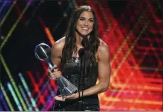  ?? PHOTO BY CHRIS PIZZELLO — INVISION — AP ?? Alex Morgan, a member of the U.S women’s national soccer team, accepts the award for best female athlete at the ESPY Awards on Wednesday at the Microsoft Theater in Los Angeles.