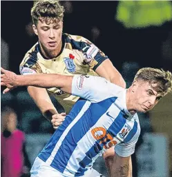  ?? SNS ?? Top: Dundee captain Darren O’Dea, right, clears while under pressure from Killie striker Kris Boyd; above: Dark Blues defender Jack Hendry challenges Eamonn Brophy.