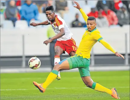  ?? Picture: GALLO IMAGES ?? TRICKY SITUATION: Ary Papel of Angola and Bafana’s Rivaldo Coetzee will face off again at Moses Mabhida Stadium tonight