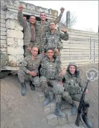  ?? COURTESY MINISTRY OF DEFENSE OF ARMENIA ?? These Armenian troops were engaged in conflict with Azerbaijan before being killed in action earlier this month. Gregor Tagvoryan, who has ties to Fitchburg, stands in the back and to the right of the group.