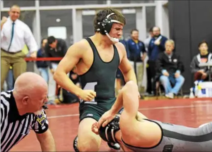  ?? AUSTIN HERTZOG - DIGITAL FIRST MEDIA ?? Methacton’s Brendan Marion reacts after his pin at 170 to place fifth and qualify for states Saturday at the South East AAA Regional. Above, Below, Owen J. Roberts’ Cole Meredith leaps into the arms of head coach Steve DeRafelo after placing fifth at...