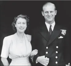  ?? AP PHOTO/FILE ?? This file photo dated July 10, 1947, shows the official photograph of Britain’s Princess Elizabeth and her fiance, Lt. Philip Mountbatte­n in London. Buckingham Palace says Prince Philip, husband of Queen Elizabeth II, has died aged 99.