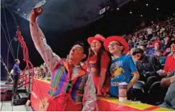  ??  ?? Ringling Bros clown Ivan Skinfill poses for a selfie photo with children during the intermissi­on of a show, in Providence, RI.