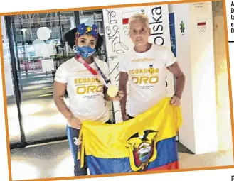  ?? ?? Alexei Ignatov y Neisi Dajomes tras la conquista de la histórica medalla de oro en halterofil­ia en los Juegos Olímpicos de Tokio.