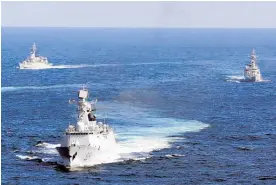  ?? Photo / AP ?? Chinese Navy vessels during a drill in the waters off Zhoushan in east China's Zhejiang province.