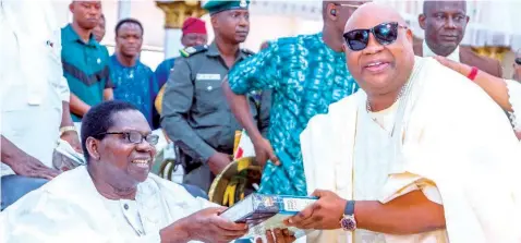  ?? ?? Evangelist Ebenezer Fabiyi Obey ( left) and Osun State Governor, Ademola Adeleke, during the 82nd birthday ceremony of the musician at Decross Gospel Mission Church, Agege, Lagos… yesterday.