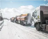  ?? MAXIM BABENKO/THE NEW YORK TIMES ?? Siberian truck drivers, who travel massive ice highways, are true believers in climate change.