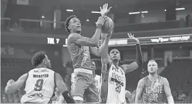  ?? ETHAN MILLER/ GETTY IMAGES ?? Ron Holland (with ball) plays for the G League Ignite and is expected to be a first-round NBA draft pick.