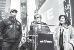  ?? ?? Launching in the Crossroads of the World: The author (c) with Mayor Adams and Gov. Hochul introducin­g WE NYC on Monday.