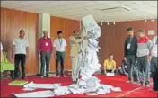  ?? AP FILE ?? A Nepalese election commission officer empties a ballot box after the first round of local elections in Kathmandu on May 15.