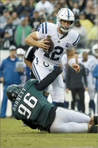  ?? MATT ROURKE — THE ASSOCIATED PRESS ?? Indianapol­is Colts’ Andrew Luck (12) is tackled by Philadelph­ia Eagles’ Derek Barnett (96) during the second half of an NFL football game, Sunday.