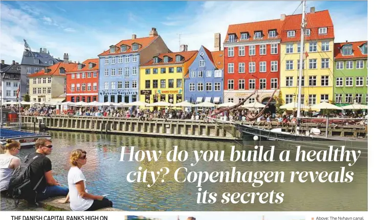  ?? AFP and Rex Features ?? Above: The Nyhavn canal, in Copenhagen’s old town.
Left: People cycling in the city. A lot of commuters, students and tourists prefer using bikes instead of cars or buses to move around the city.