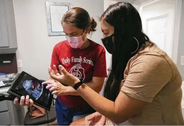  ??  ?? Some maternal health experts argue that increasing access to midwives could improve care for mothers and babies. Certified nurse midwife Shawn Pompa is among the midwives who provide care at Holy Family Birth Center in the Rio Grande Valley.