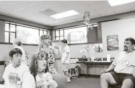  ?? Joe Center ?? Troy Haney, right, volunteers each summer as a counselor at Super Place Camp, a vacation Bible school-type camp for children with disabiliti­es.