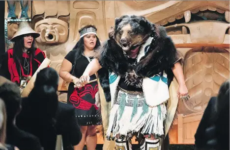  ?? TODD EASTERBROO­K ?? Dancers, singers and drummers perform Saturday at the Audain Art Museum in Whistler during the inaugurati­on of James Hart’s The Dance Screen (The Scream Too). The 4.75-by-3.2-metre screen features a portal that marks the divide between he spirit world and the human world.