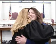  ?? BILL UHRICH-MEDIANEWS GROUP ?? Newly sworn-in Berks County Commission­er Lucine E. Sihelnik is hugged by President Judge M. Theresa Johnson following the ceremony Tuesday in the Berks County Courthouse. Sihelnik former Commission­er Kevin S. Barnhardt, who had resigned to become the county’s chief operating officer.