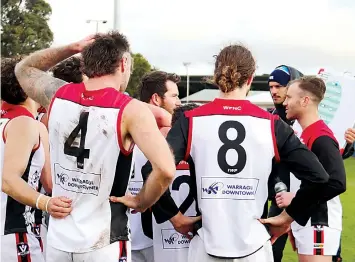  ?? Photograph­s Nicholas Duck ?? Acting as coach for the day, Warragul’s Nick Graham (right) addresses his troops at three quarter time.