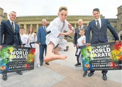  ?? Picture: Kris Miller. ?? Jude Steven in action, watched by members of Kanzen, Liviu Crisan, president of the World Union of Karate Federation­s (WUKF) and Lord Provost Bob Duncan.