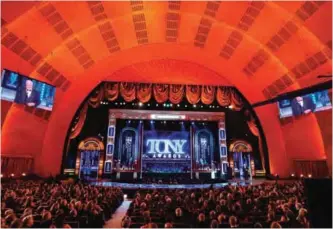  ??  ?? James Earl Jones, right, walks on stage to accept the special Tony award for Lifetime Achievemen­t.