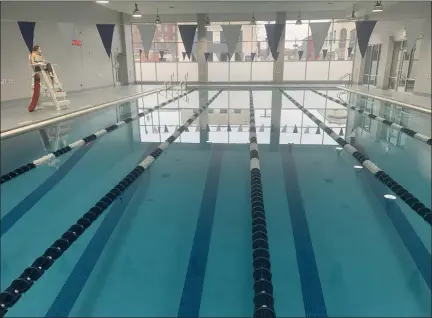  ?? TANIA BARRICKLO — DAILY FREEMAN ?? In this photo taken Friday, Jan. 15, Taylor Robey, a lifeguard at the Kingston YMCA, sits above the newly renovated pool that opened in late November.